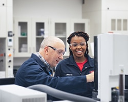 Melanie Robinson and a colleague in the lab